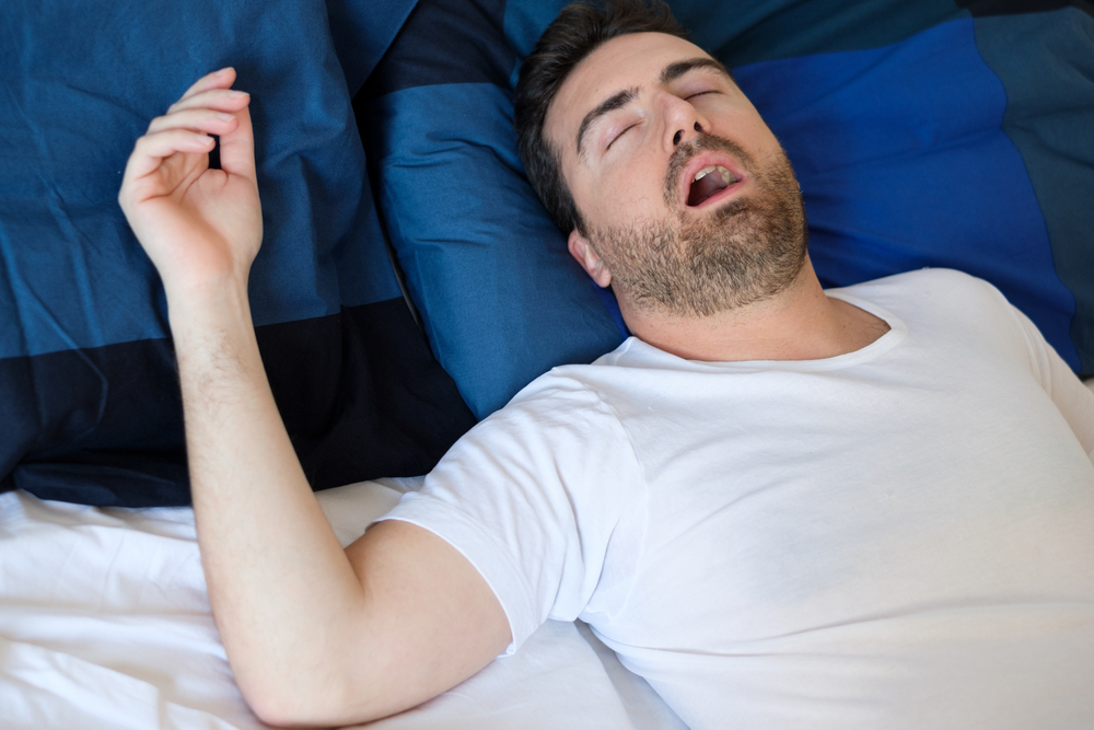 Man,In,Bed,Suffering,For,Sleep,Apnea,Syndrome