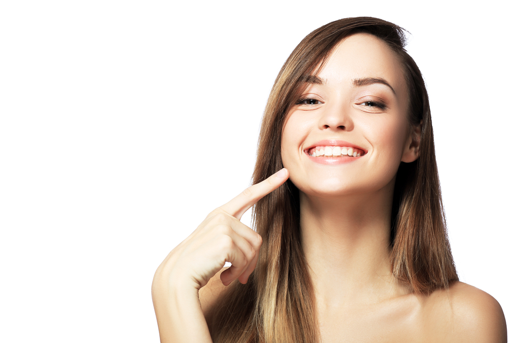 Picture,Of,Beautiful,Woman,Pointing,To,Teeth
